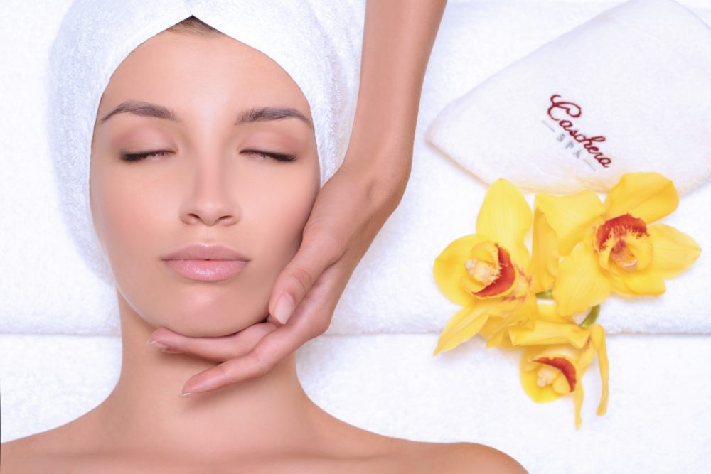 Relaxing facial treatment with yellow orchids